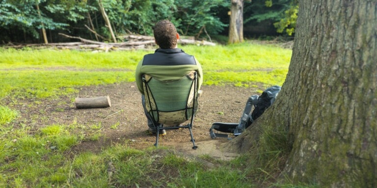 A picture of me sitting in the chair to test for our Kamui Camping Chair review