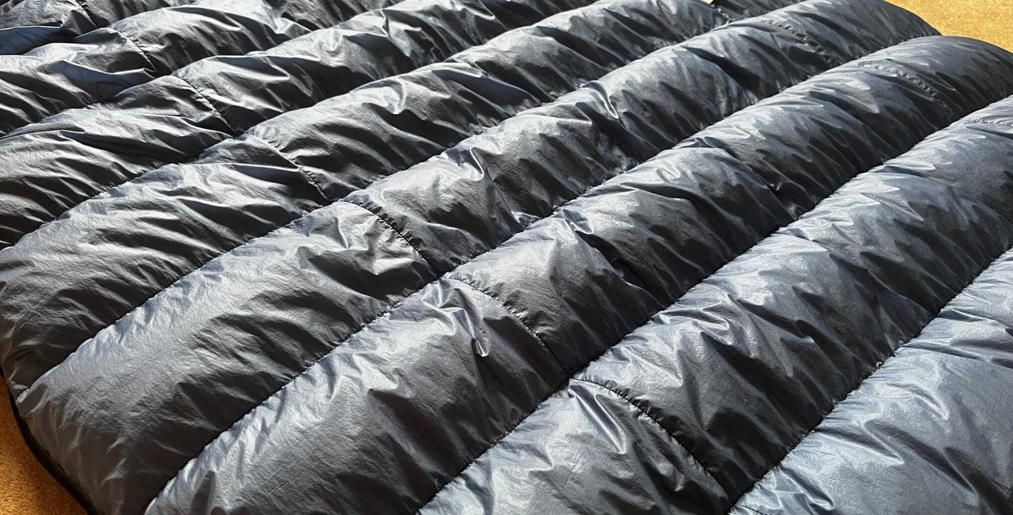 a close-up photo of puffy baffles on a down sleeping bag