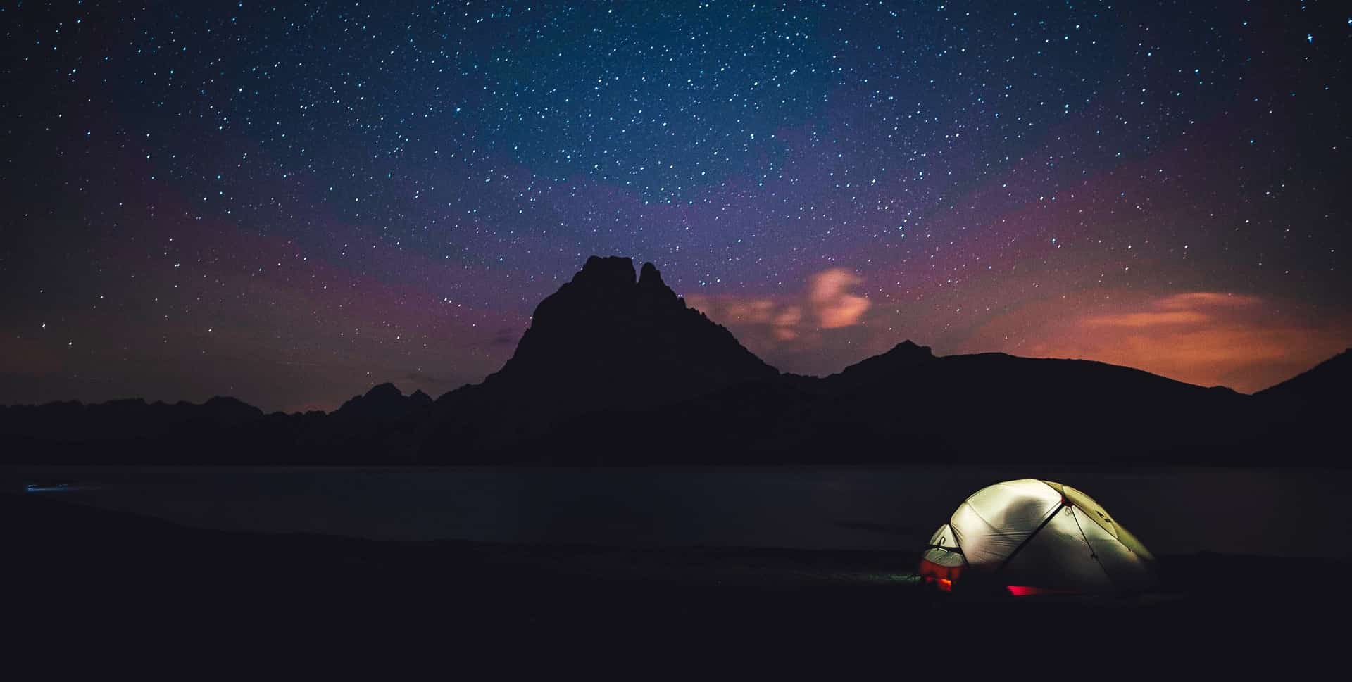 Warm tent on a starry night