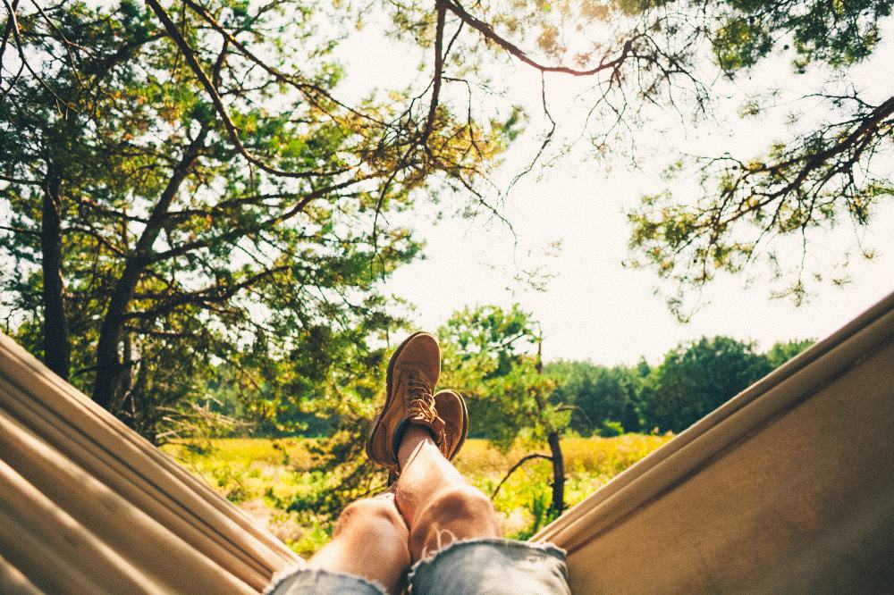 A person relaxing in a hammock