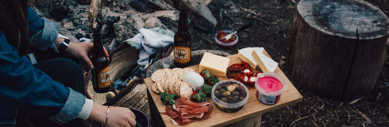 Food platter beside a campfire