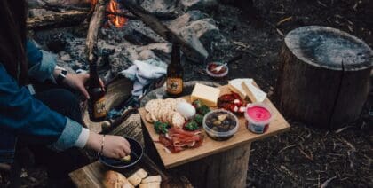 Food platter beside a campfire