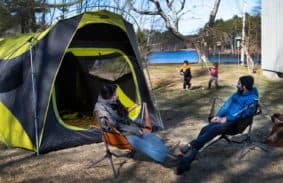 The Nemo Wagontop family tent with kids playing outdoors on a camping trip