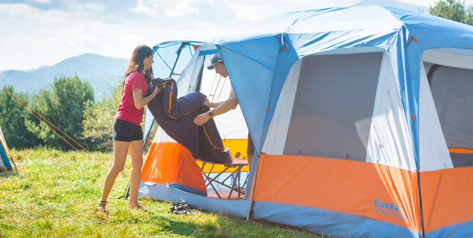 Lifting a sleeping bag out of a Eureka Copper Canyon LX cabin tent