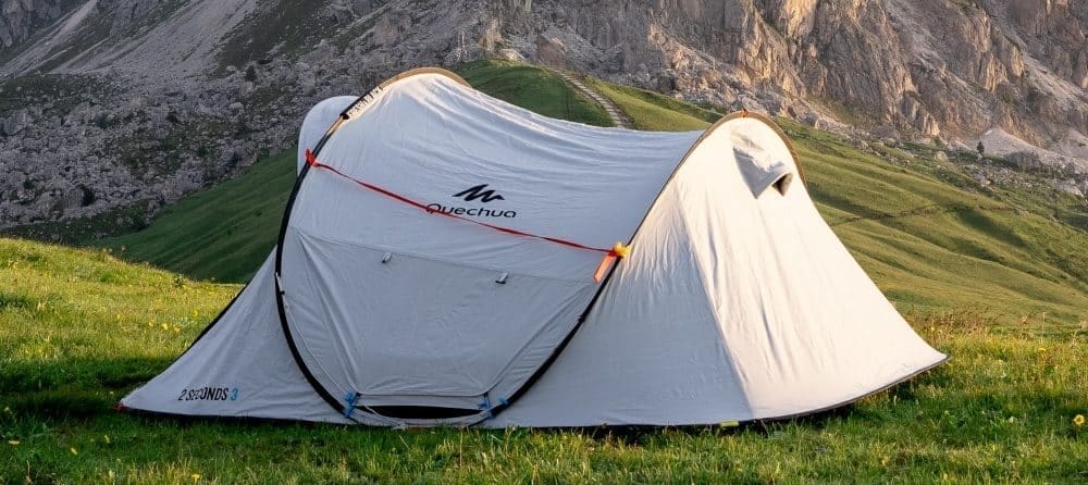 A blackout pop up tent in an alpine environment.