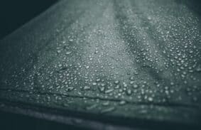 Water droplets on the roof of a tent