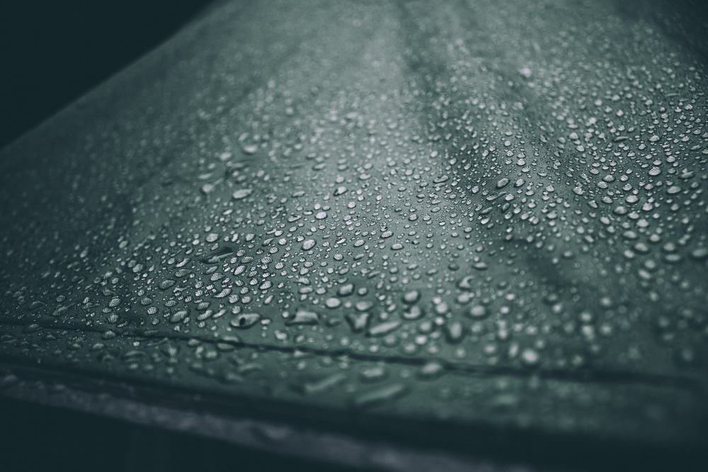 Water droplets on the roof of a tent