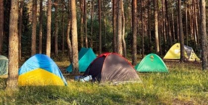 Different types of tents set up for camping outdoors