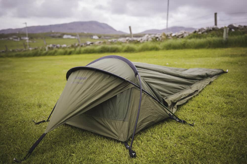 Snugpak bivy set up on a field in the great outdoors