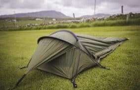 Snugpak bivy set up on a field in the great outdoors