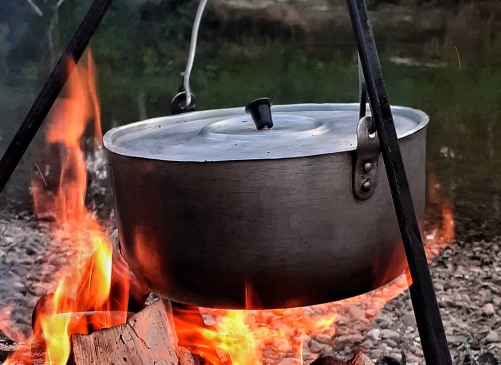 Camp cooking is a social event that the whole group can get involved with. 