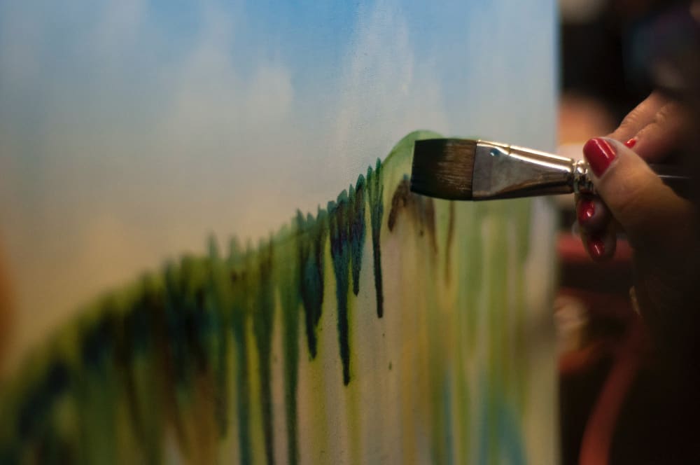 painting inside a tent on a rainy day is a great activity for young and old when camping. 