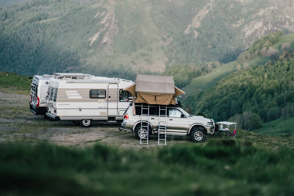 A truck camper with sleeping on top leaves more room inside the truck for more gear. 