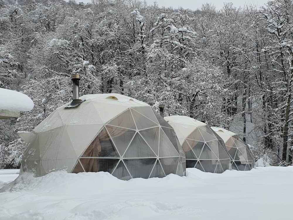 A wood stove in a big tent allows year round liveability.