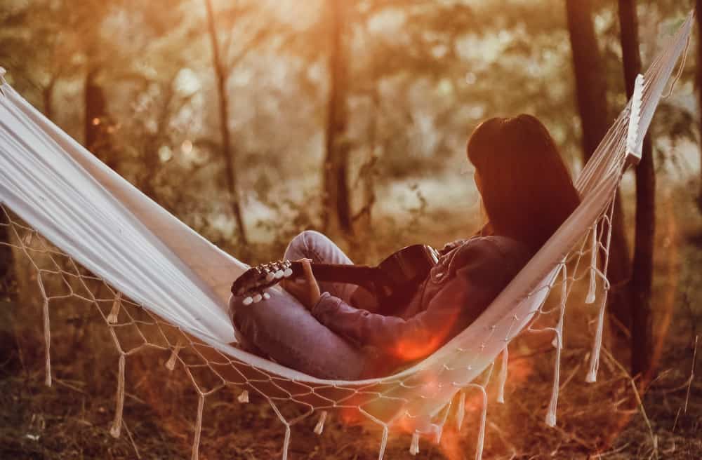 After a long day hiking, relaxing in a hammock with a guitar or a drink is the perfect way to end the day. 