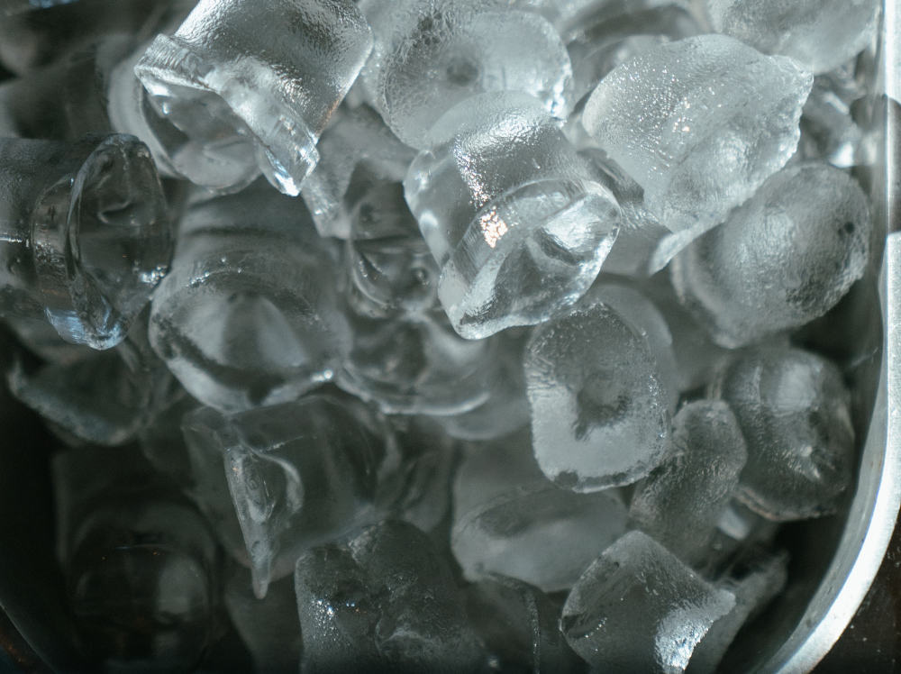 Use normal ice cubes in your cooler to cool it before putting in your ice cream and other frozen foods.