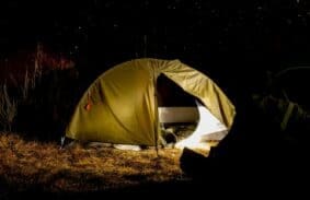 A camper's tent with an electric blanket to stay warm