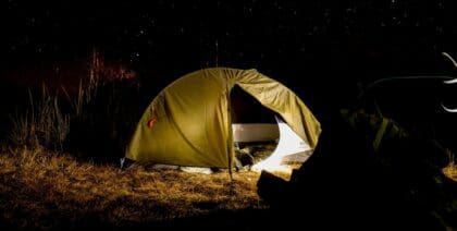 A camper's tent with an electric blanket to stay warm