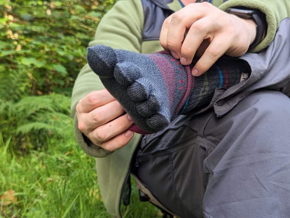 Injinji hiking socks being put on