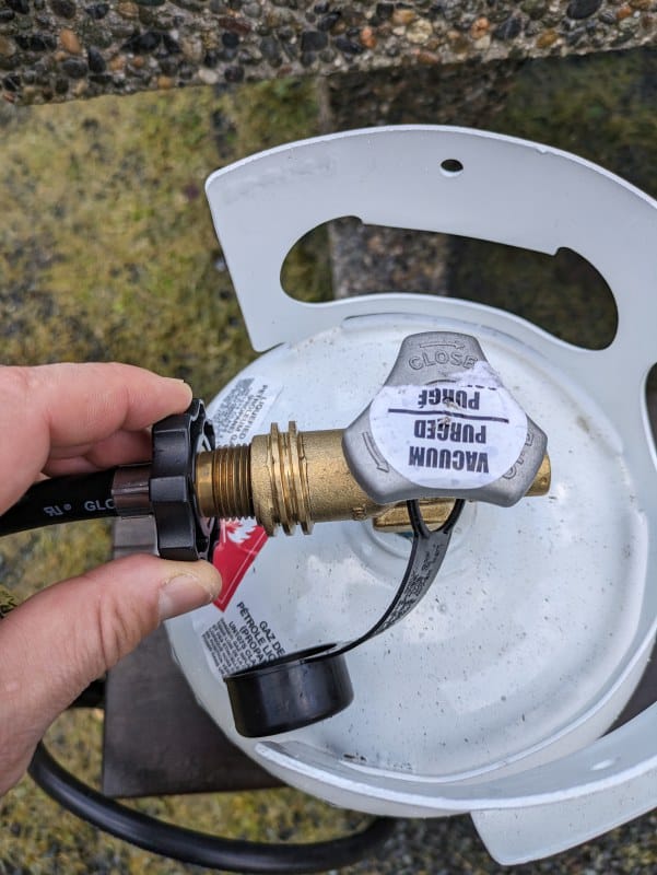 Connecting the hose to the propane tank